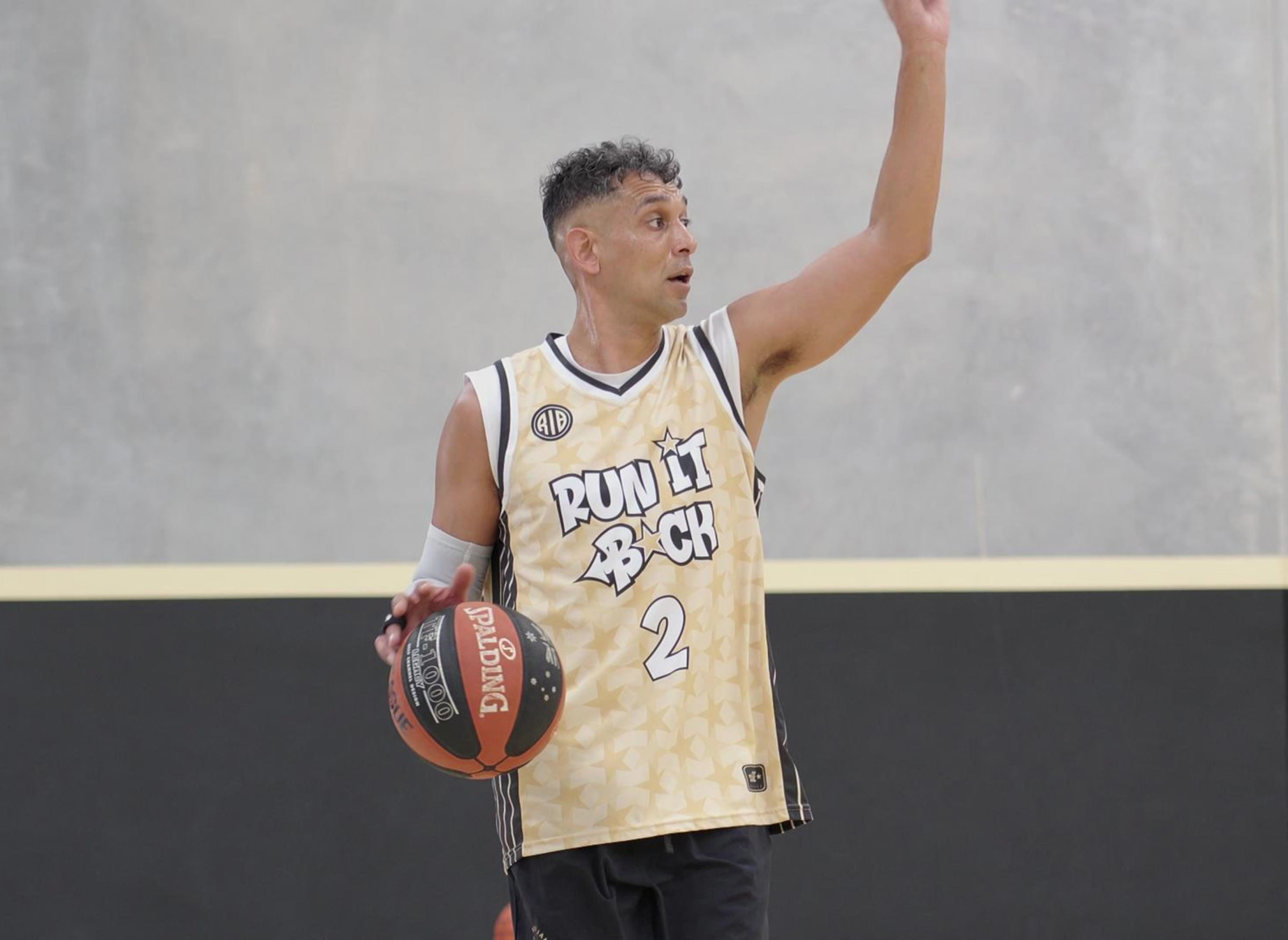 Basketball player wearing a Run It Back uniform